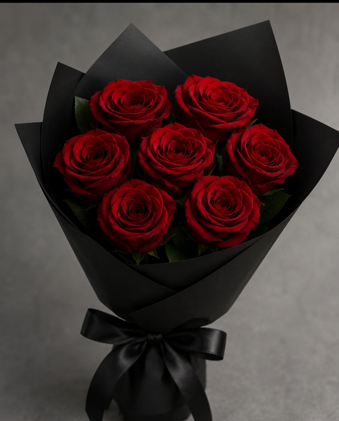 Six Red Roses in Elegant Black Wrap